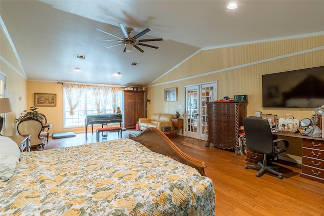 bedroom with vaulted ceiling, wood-type flooring, crown molding, and french doors