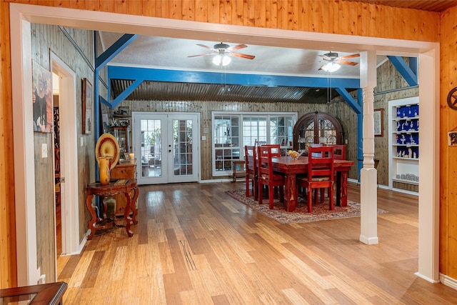 dining space with hardwood / wood-style floors and french doors