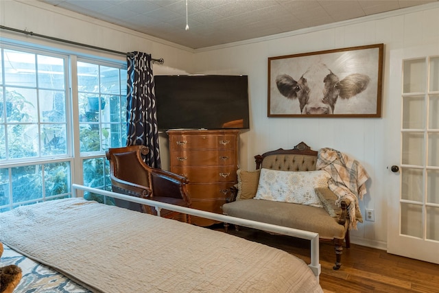 bedroom featuring crown molding and hardwood / wood-style floors