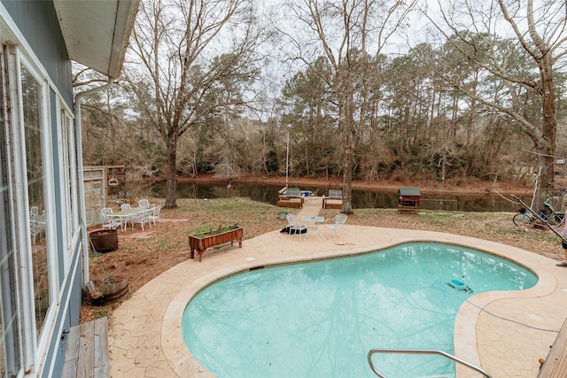 view of swimming pool with a patio