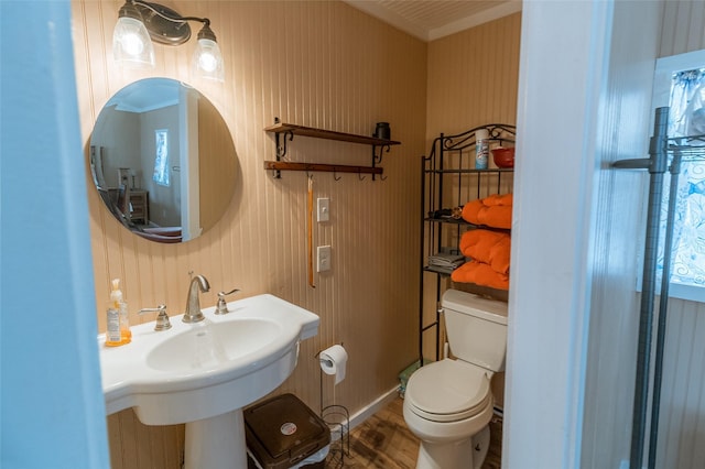 bathroom with hardwood / wood-style floors, sink, and toilet