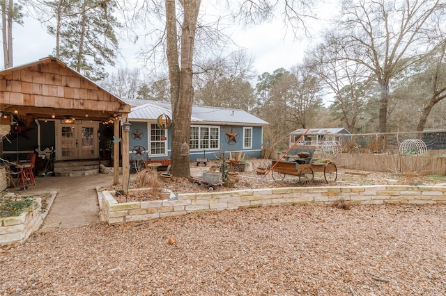 back of property with french doors