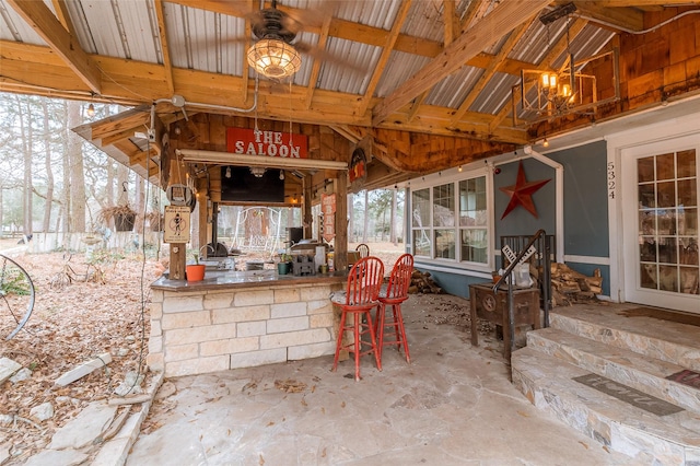 view of patio with ceiling fan and exterior bar