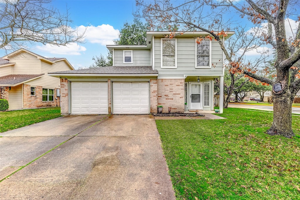 view of property with a garage and a front lawn