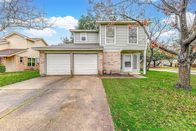 view of property with a garage and a front lawn