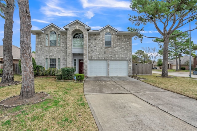 view of front of property featuring a garage and a front yard