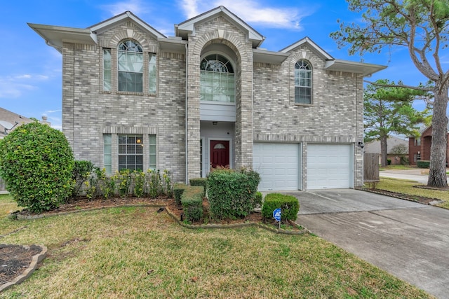 view of front property with a garage and a front lawn