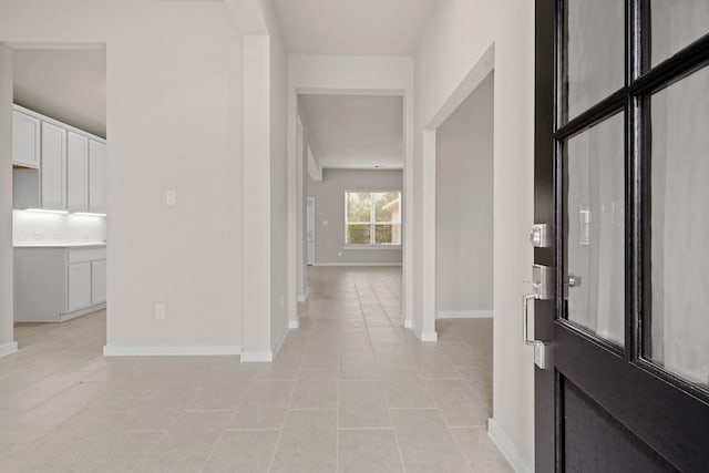 foyer entrance featuring light tile patterned floors