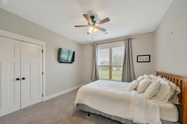 bedroom featuring a closet, ceiling fan, and carpet flooring