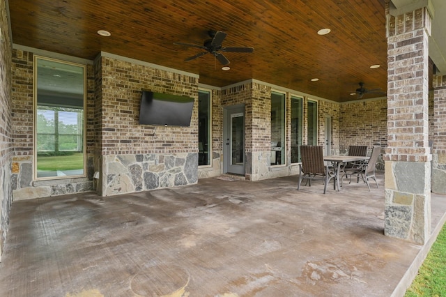 view of patio featuring ceiling fan