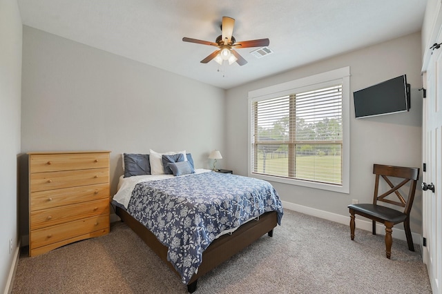 bedroom with ceiling fan and carpet