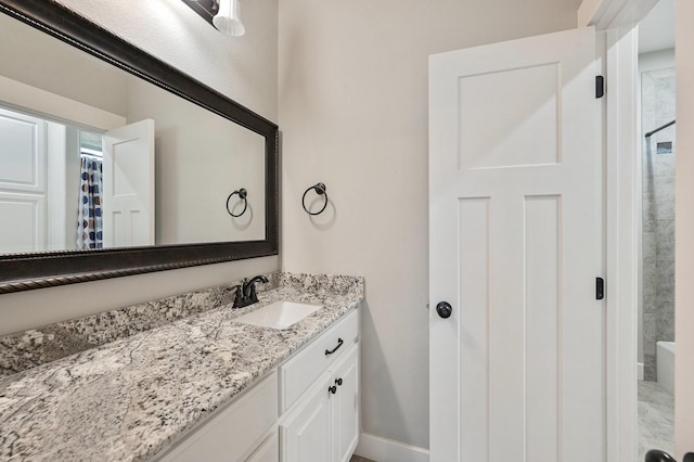 bathroom with vanity and walk in shower