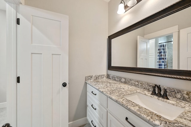 bathroom with vanity and a shower with shower curtain