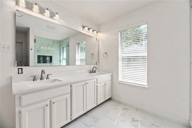 bathroom featuring vanity and an enclosed shower