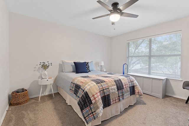 bedroom featuring light colored carpet and ceiling fan