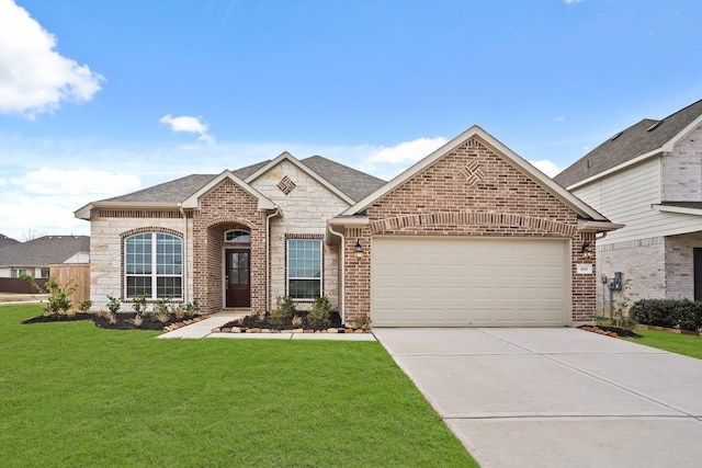 view of front of home featuring a garage and a front lawn