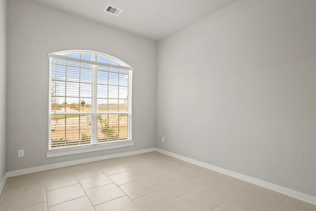 view of tiled spare room