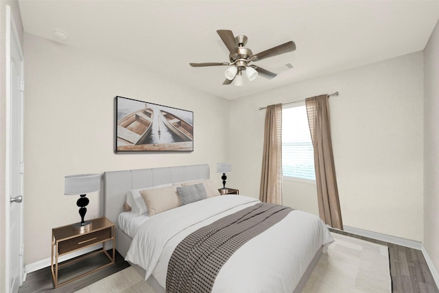 bedroom featuring light hardwood / wood-style floors and ceiling fan