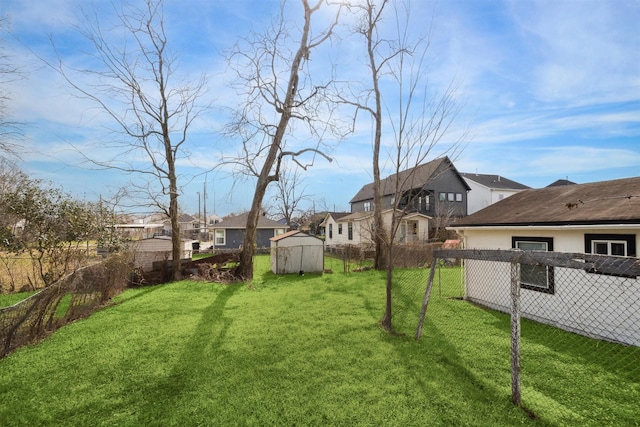 view of yard featuring a storage unit