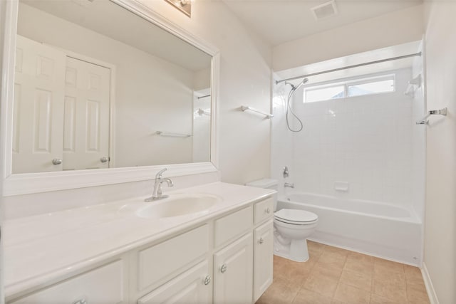 full bathroom with tiled shower / bath, vanity, and toilet