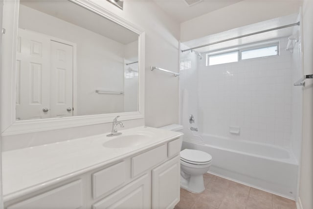 full bathroom featuring tiled shower / bath combo, vanity, and toilet