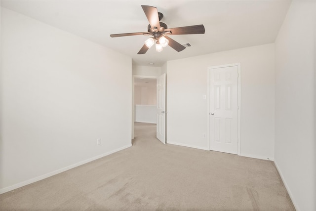 unfurnished bedroom featuring ceiling fan and light carpet