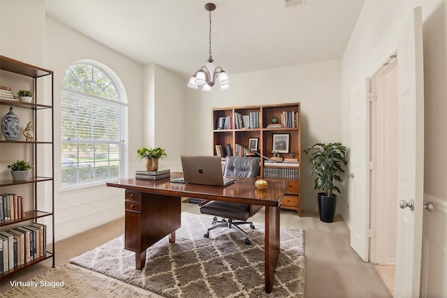 office space featuring a chandelier