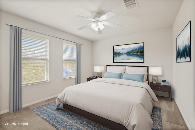 carpeted bedroom featuring ceiling fan