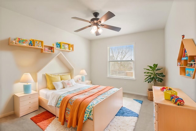 bedroom with ceiling fan and light colored carpet