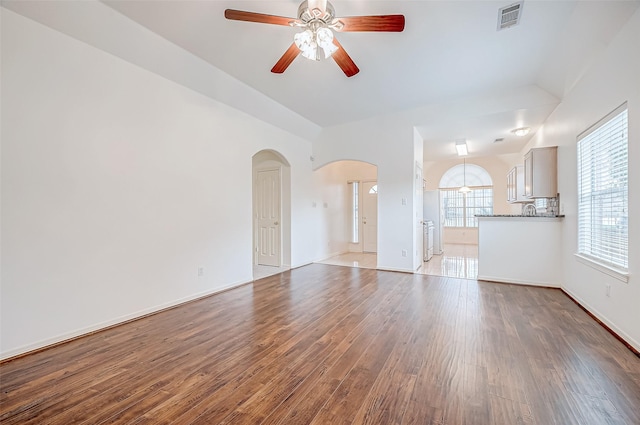 unfurnished living room with hardwood / wood-style flooring and ceiling fan