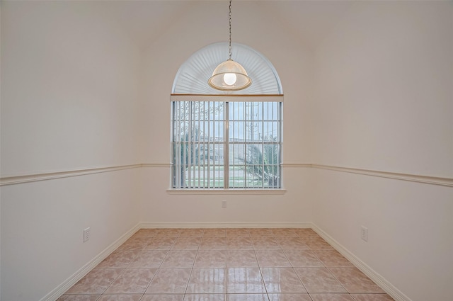 spare room featuring light tile patterned flooring