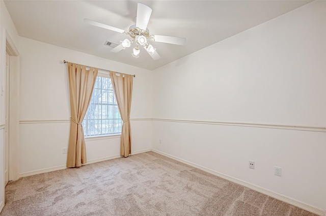 empty room with light carpet and ceiling fan