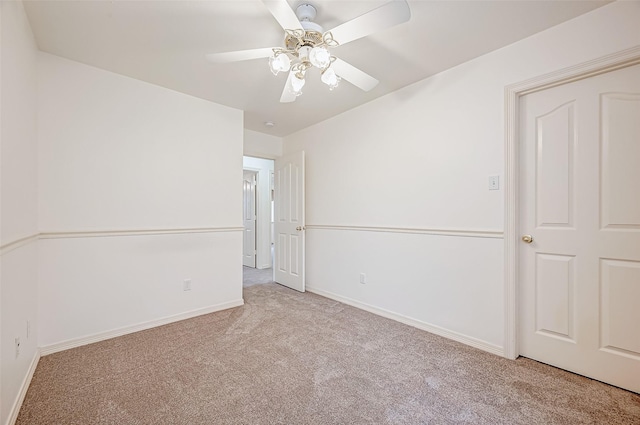 unfurnished bedroom with light colored carpet and ceiling fan