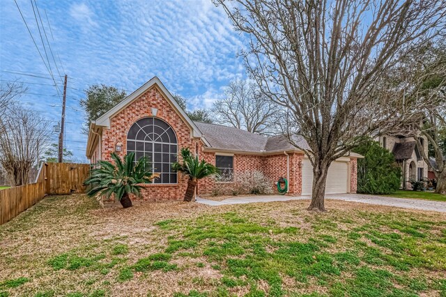 view of front facade with a garage and a front yard