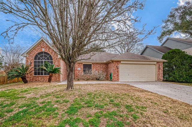 view of front of property featuring a garage and a front yard