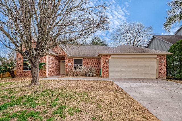 ranch-style house featuring a garage and a front yard