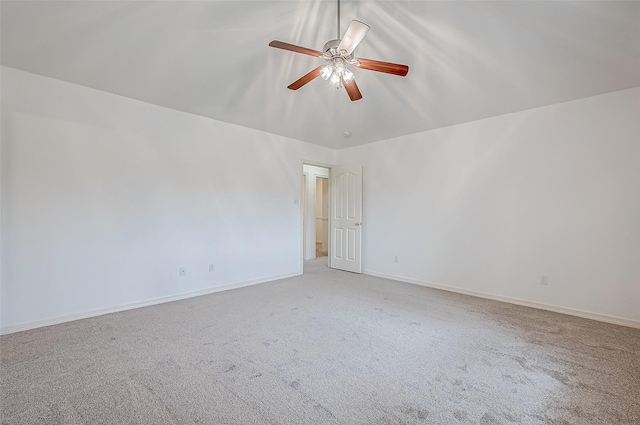 unfurnished room featuring ceiling fan and carpet flooring