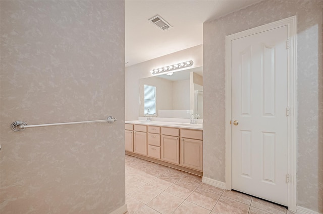 bathroom featuring vanity and tile patterned flooring