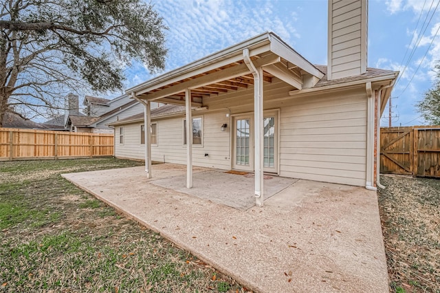 back of house with a patio