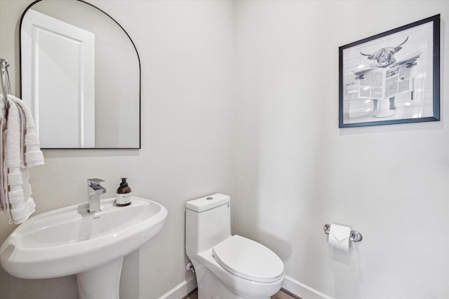 bathroom with toilet and sink