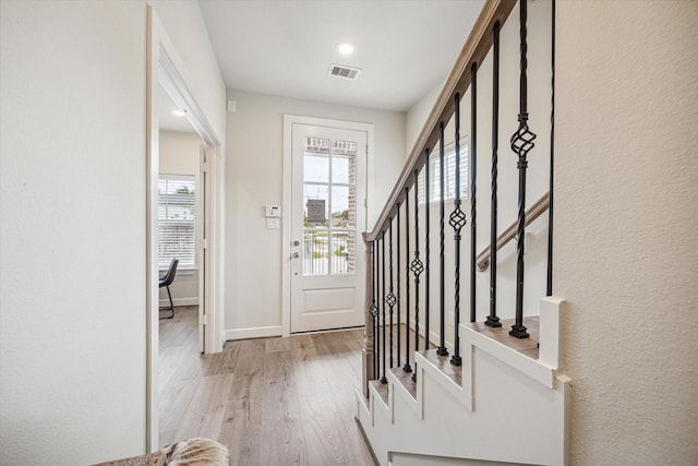 entrance foyer with light hardwood / wood-style floors