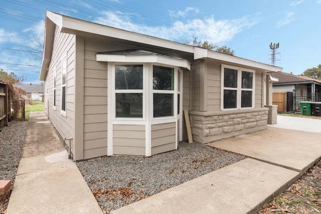 view of property exterior featuring a patio area