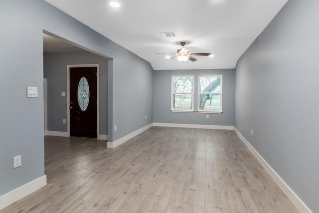 foyer with ceiling fan and light hardwood / wood-style floors