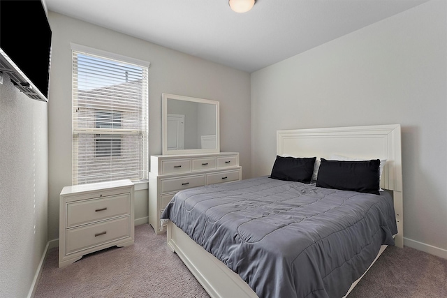 bedroom featuring light colored carpet