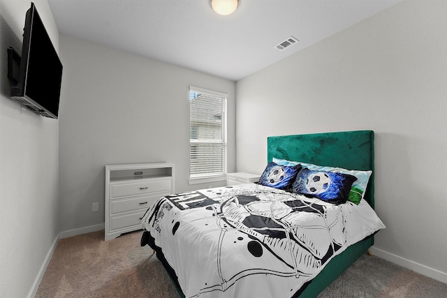 bedroom with dark colored carpet