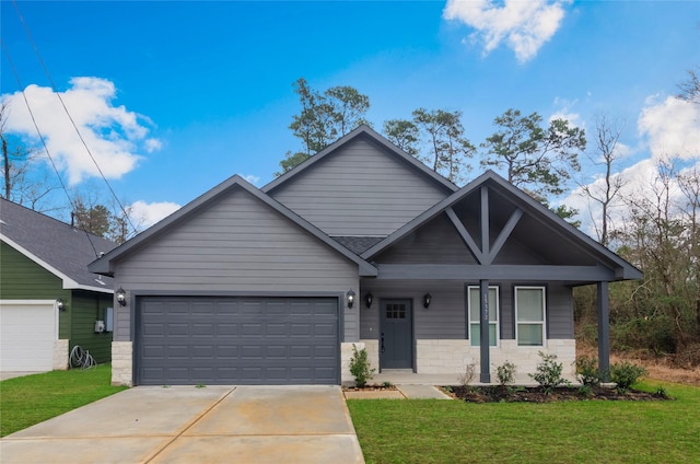 view of front of house with a garage, a porch, and a front lawn