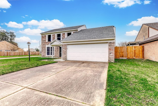 view of front of property with a garage and a front yard