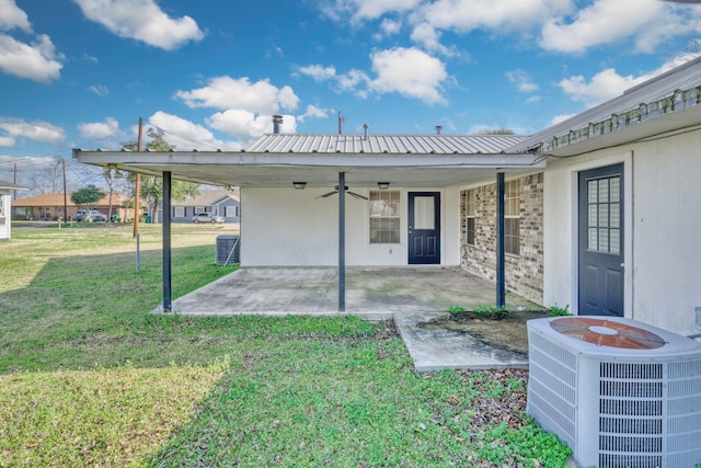 back of house with a patio, a yard, cooling unit, and ceiling fan