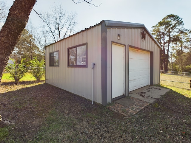 garage featuring fence