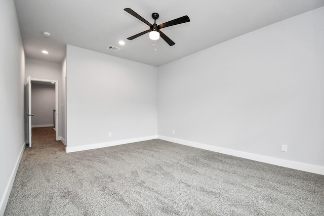 unfurnished room with ceiling fan and carpet floors